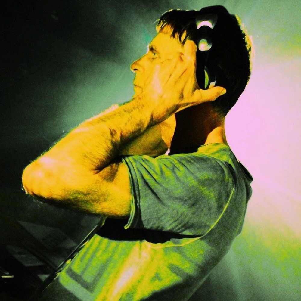 DJ Paul Dakeyne holding DJ headphones image on Mastermix website